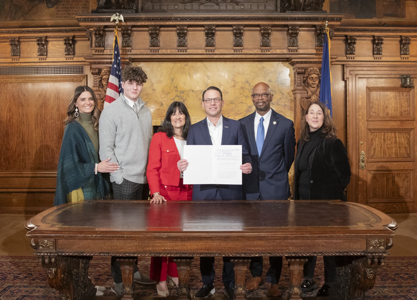 Will Montgomery, second from left, is a junior at Franklin Regional High School and because of taking advantage of dual enrollment programs, he is on pace to be the third Franklin Regional student to graduate from high school having also earned an associate degree. He is joined by his mother, Kate (left), Rep. Jill Cooper, Gov. Josh Shapiro, Rep. Stephen Kinsey and Rep. Cooper’s legislative aide Debra Wohlin. 